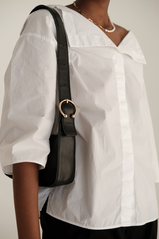 Woman in Casual Dress Shirt and Black Purse